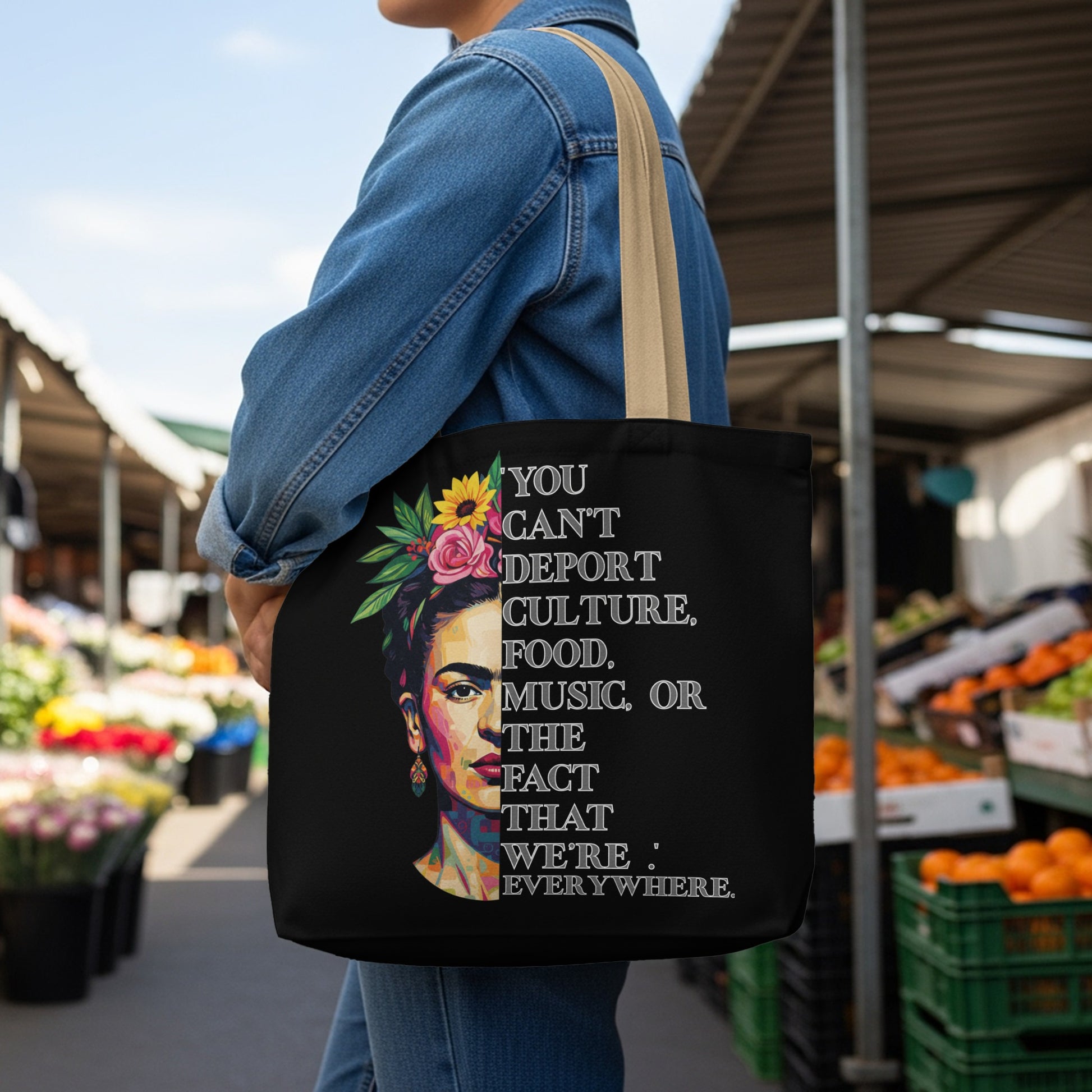 Black tote bag with Frida Kahlo portrait and empowering quote about culture.