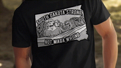 a person wearing a black t-shirt with a graphic design on the back.