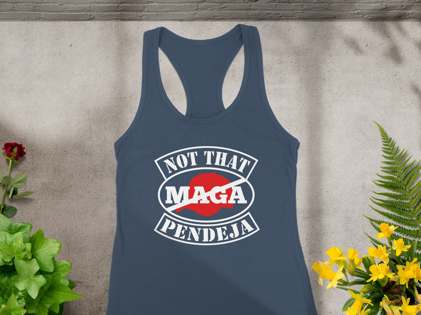 Navy racerback tank top with "NOT THAT MAGA PENDEJA" graphic in white and red.
