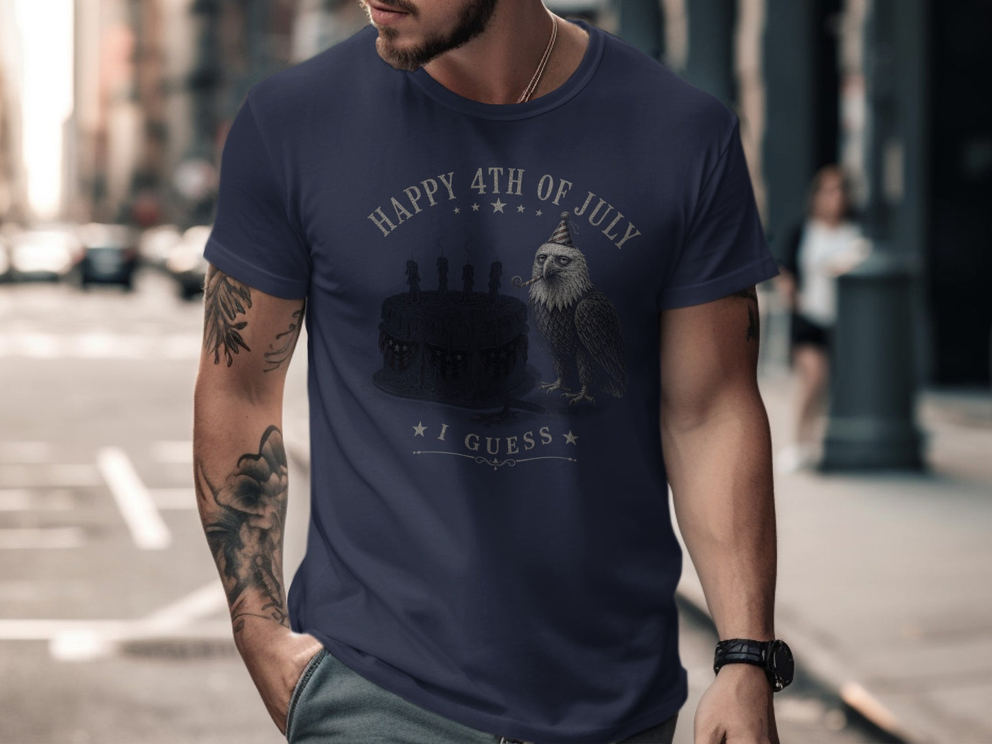 Navy t-shirt with a bald eagle wearing a party hat, holding a fork, and a birthday cake.