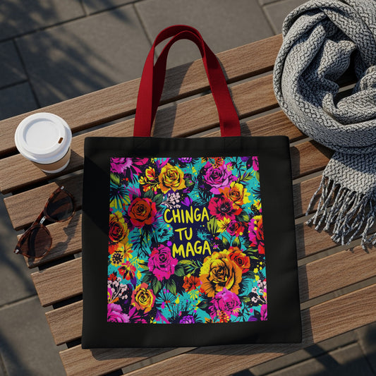 Black tote bag with vibrant floral print and "Chinga Tu Maga" text.