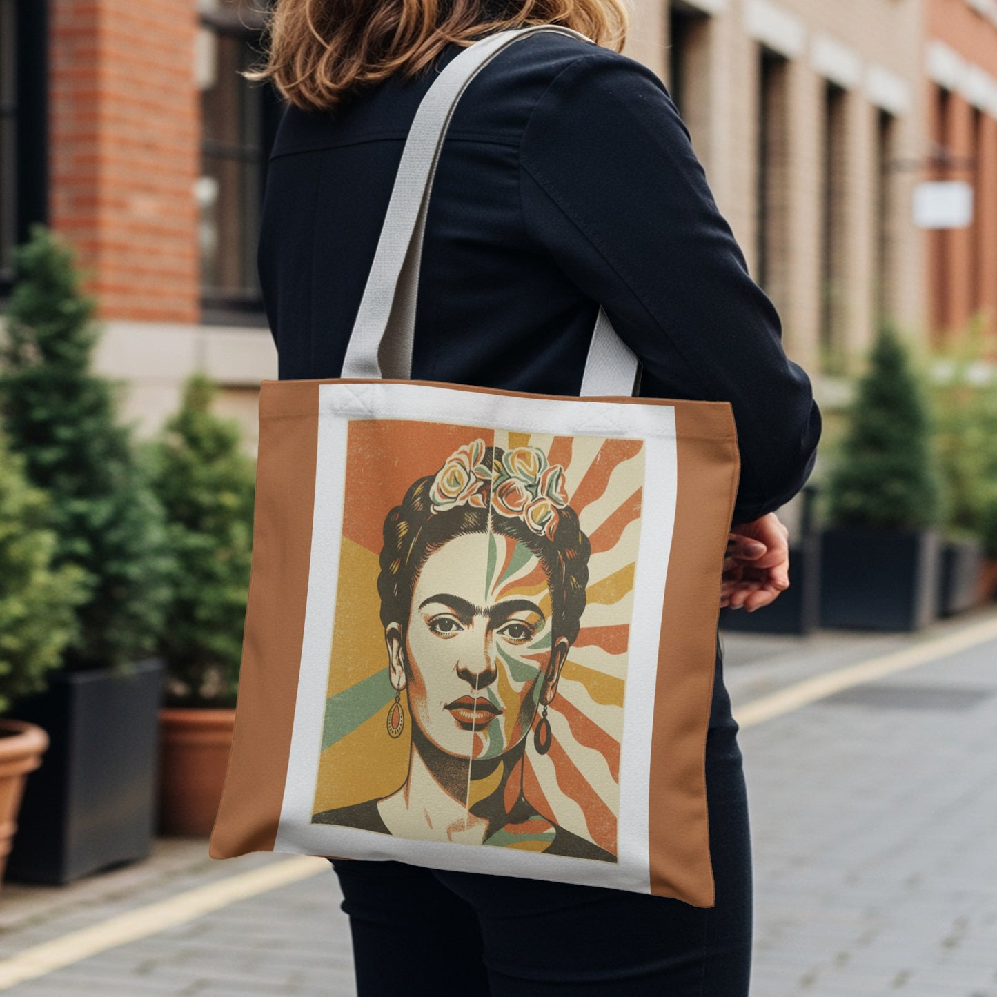 Tote bag featuring a split portrait of Frida Kahlo in bold geometric colors.