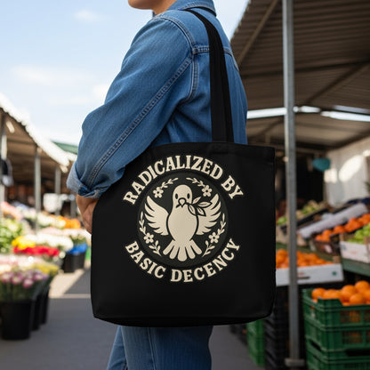 Black tote bag with white text and a dove carrying an olive branch.