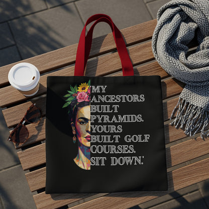 Black tote bag with Frida Kahlo portrait and text about ancestors.