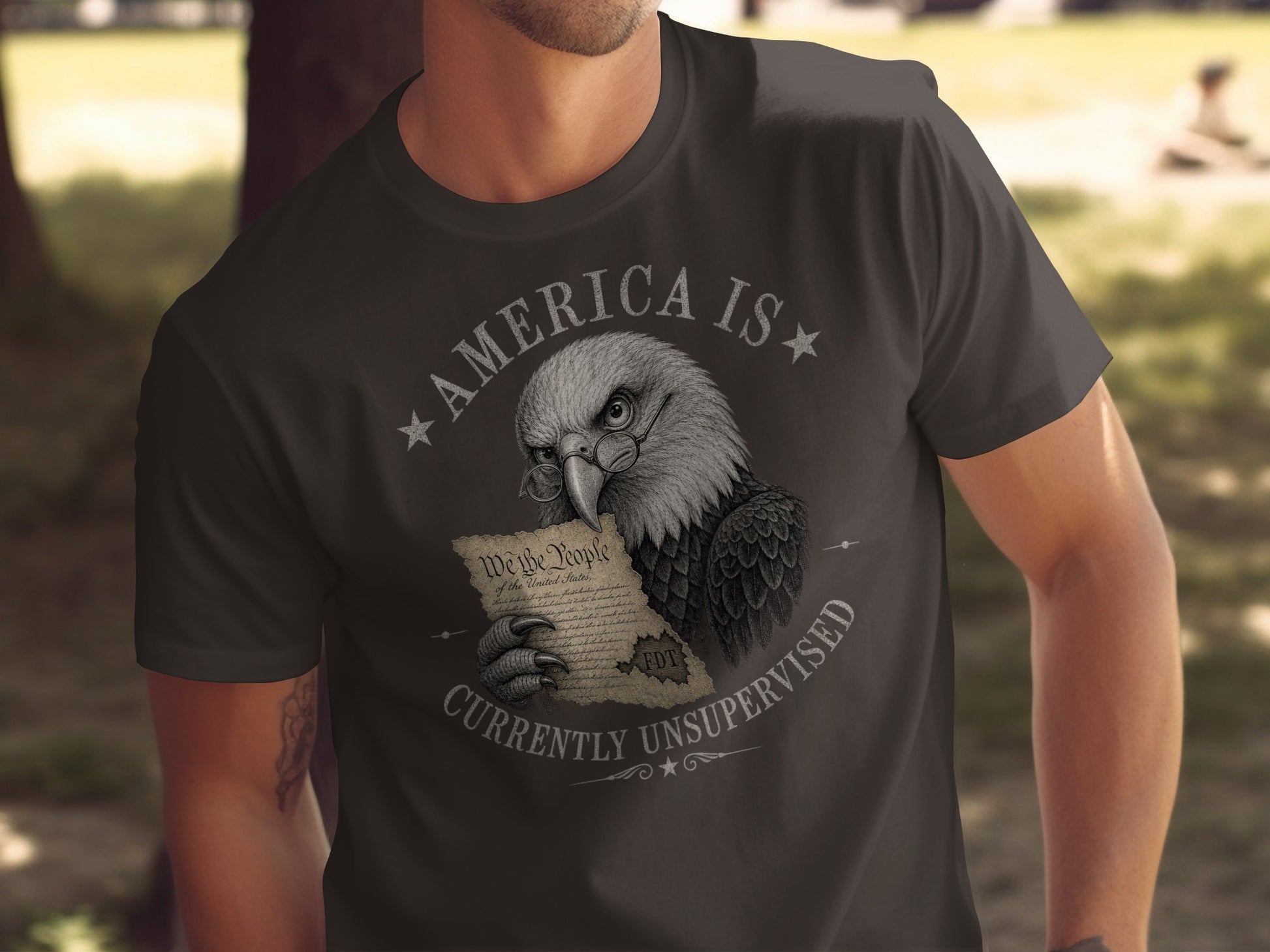 Eagle wearing glasses holds "We the People" document, "America is Currently Unsupervised" text.