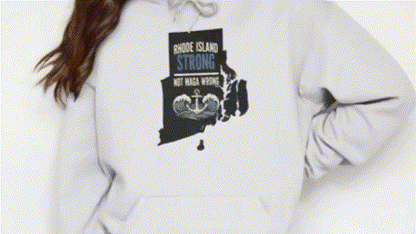 A person wearing a white hoodie with a graphic design on the front.