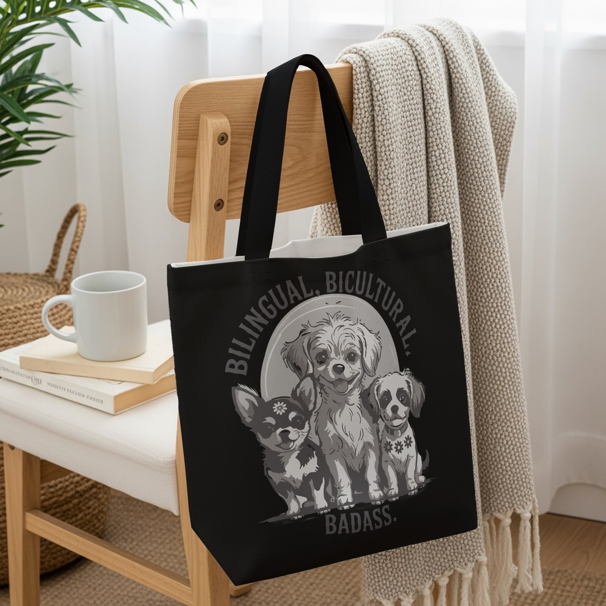 Three dogs with "Bilingual, Bicultural, Badass" text on a black tote bag.