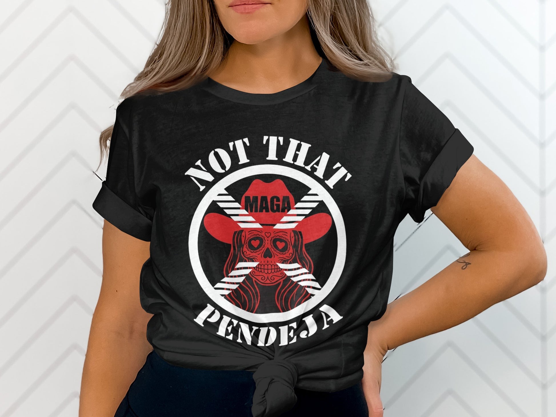 Black t-shirt with red "NOT THAT MAGA PENDEJA" text and skull design.