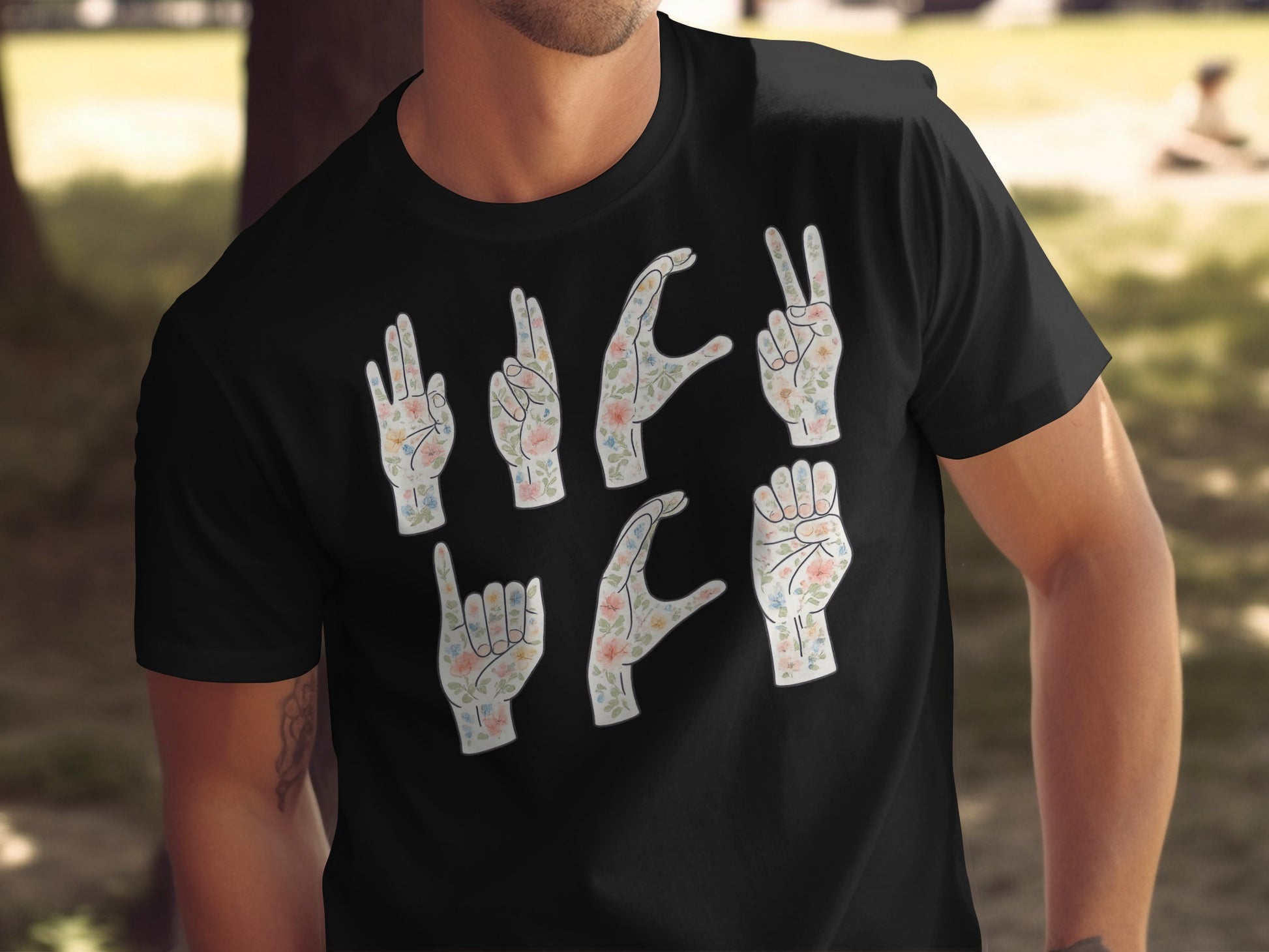 Floral Hand Gesture Graphic on Black T-Shirt Product