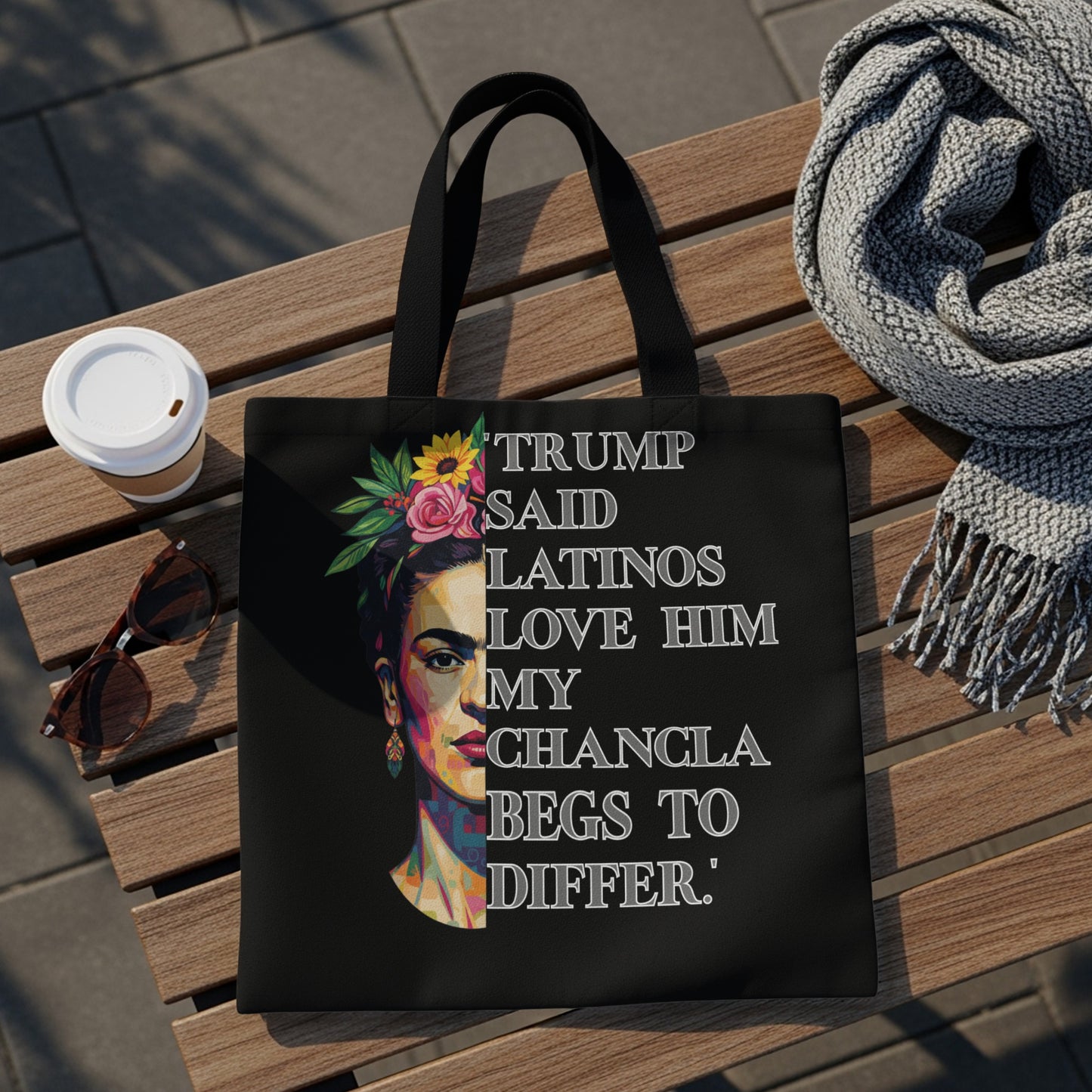 Tote bag featuring Frida Kahlo's portrait with text "Trump said Latinos love him my chancla begs to differ."