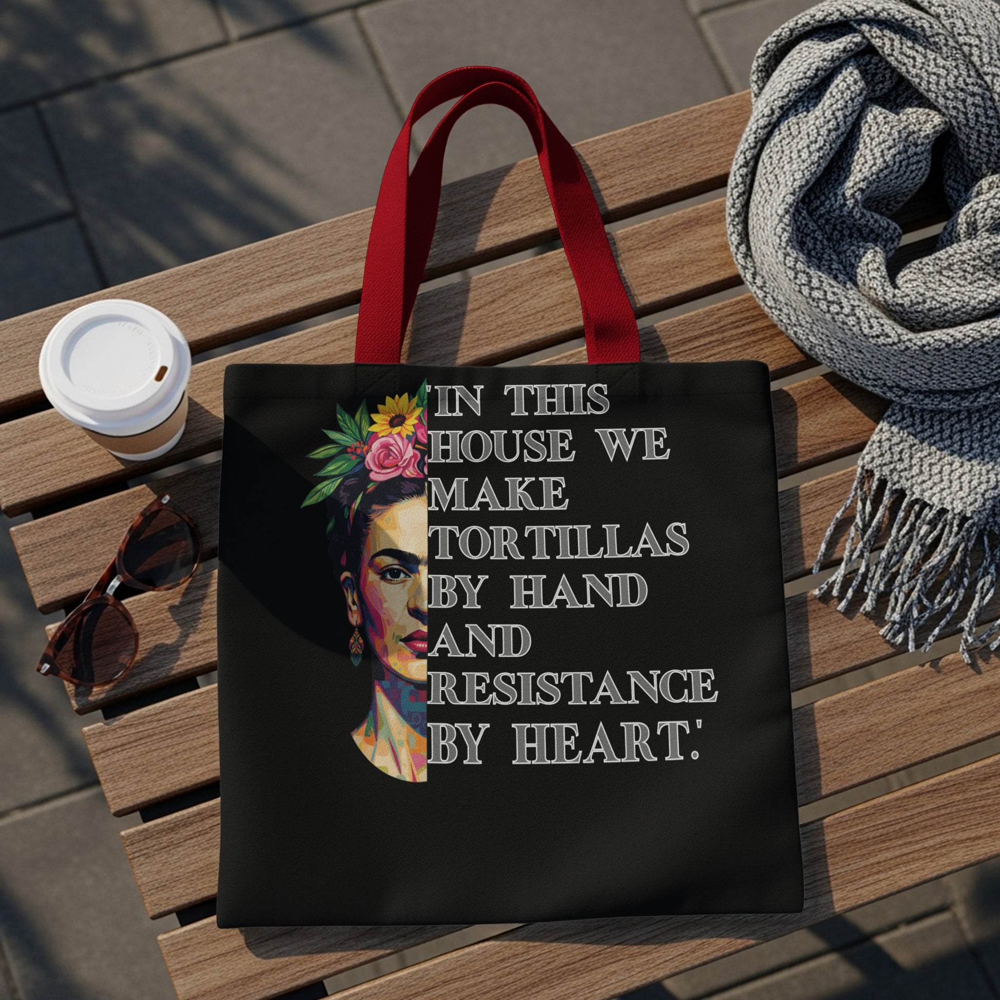 Tote bag with Frida Kahlo portrait and text: "In this house we make tortillas by hand and resistance by heart."