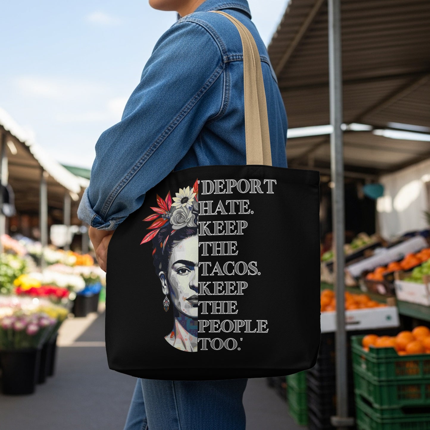 Black tote bag with Frida Kahlo portrait and text "DEPORT HATE. KEEP THE TACOS. KEEP THE PEOPLE TOO."