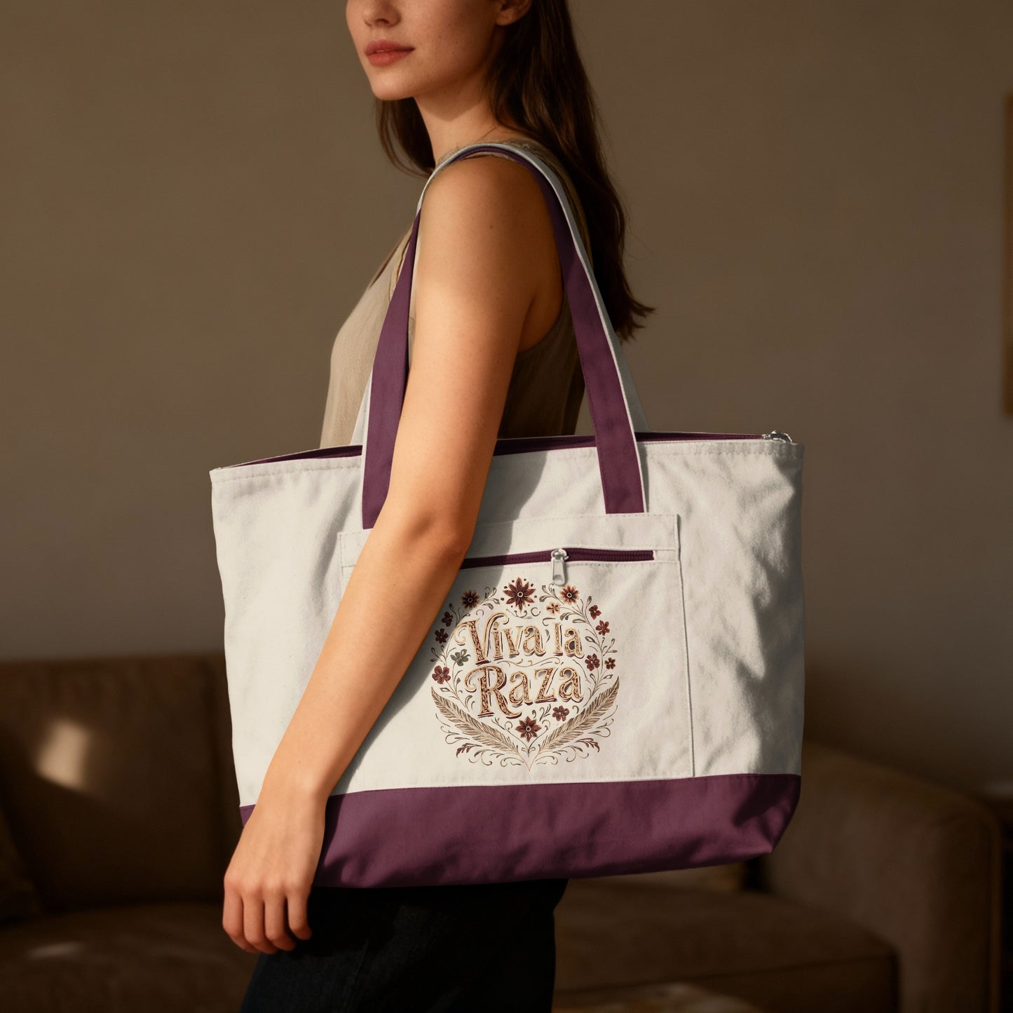 Tote bag with "Viva la Raza" text and floral design.