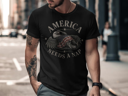 Black t-shirt with distressed eagle and US flag graphic, text reads "America Needs A Nap".