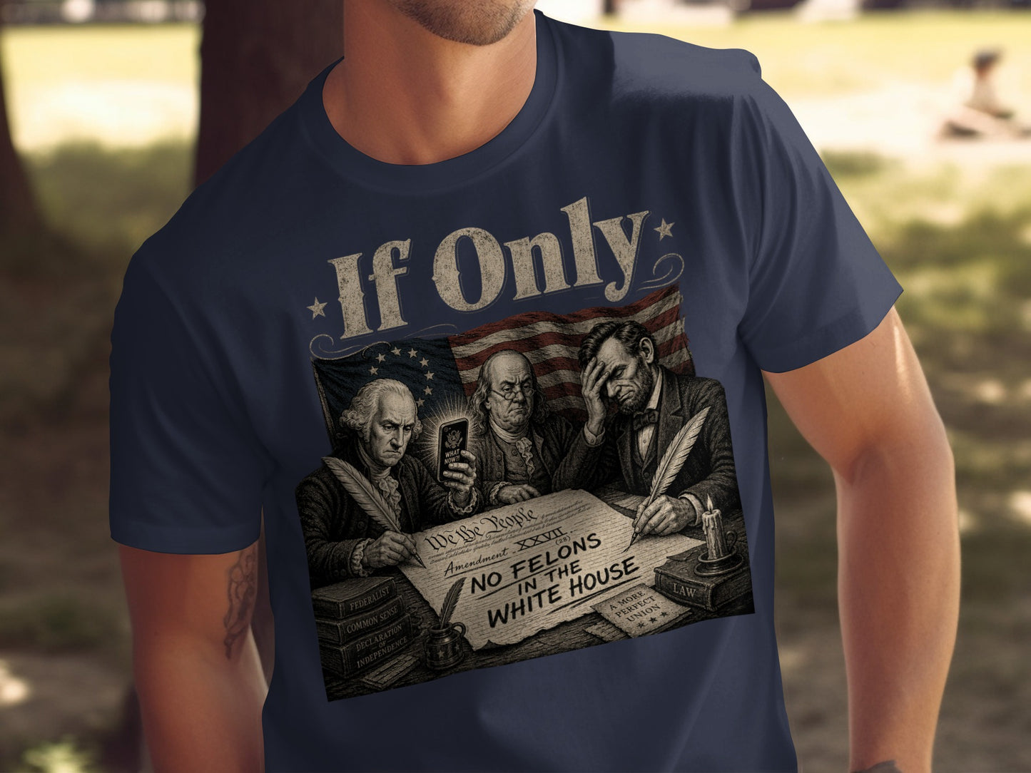 T-shirt graphic: Founding Fathers and Lincoln look at phone over Constitution, "No Felons in the White House."