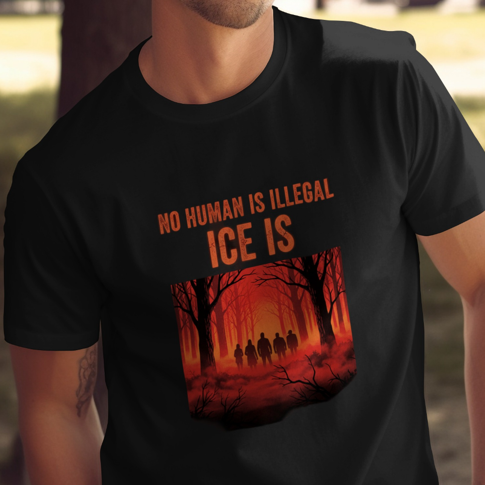 Black t-shirt with "NO HUMAN IS ILLEGAL ICE IS" and silhouetted figures in a forest.