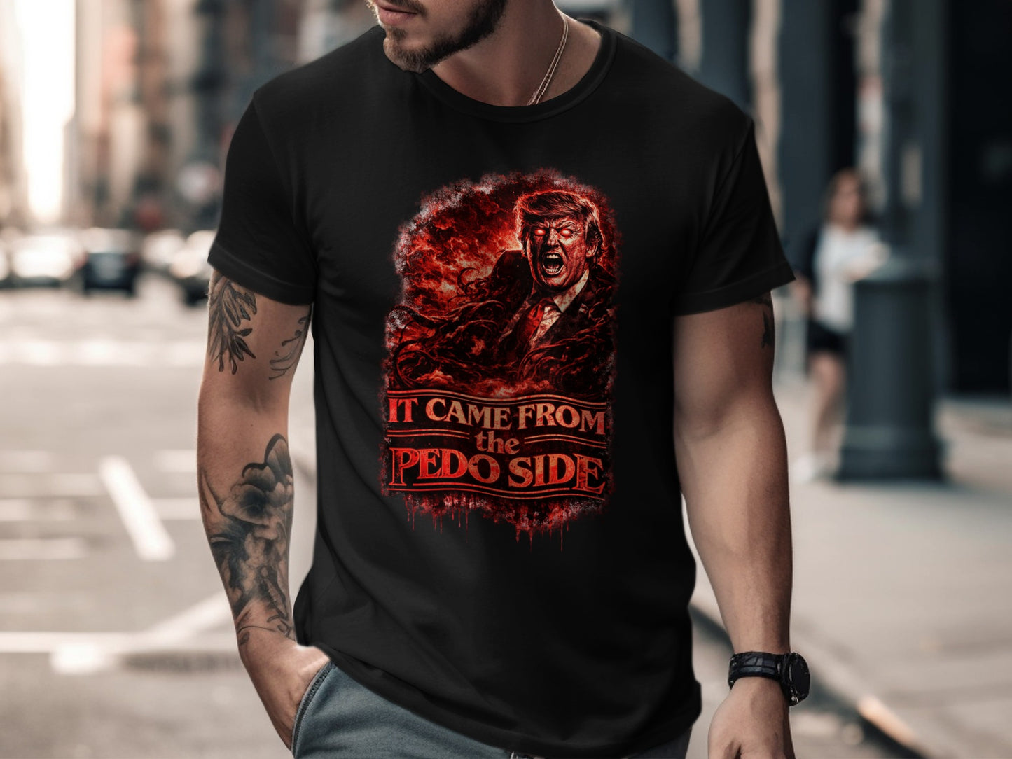 Man wearing black t-shirt with graphic of Donald Trump and text "IT CAME FROM THE PEDO SIDE".