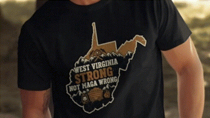 A black t-shirt with a graphic design depicting a map of West Virginia and the text "West Virginia Strong Not Maga Wrong".