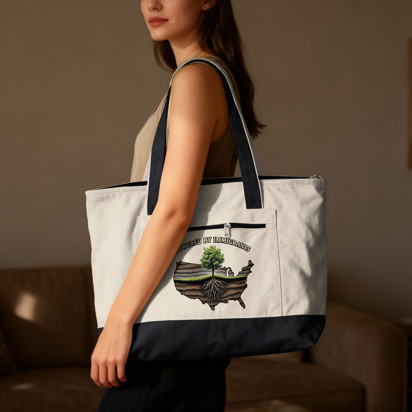Tote bag with "Powered by Immigrants" text and U.S. map graphic.
