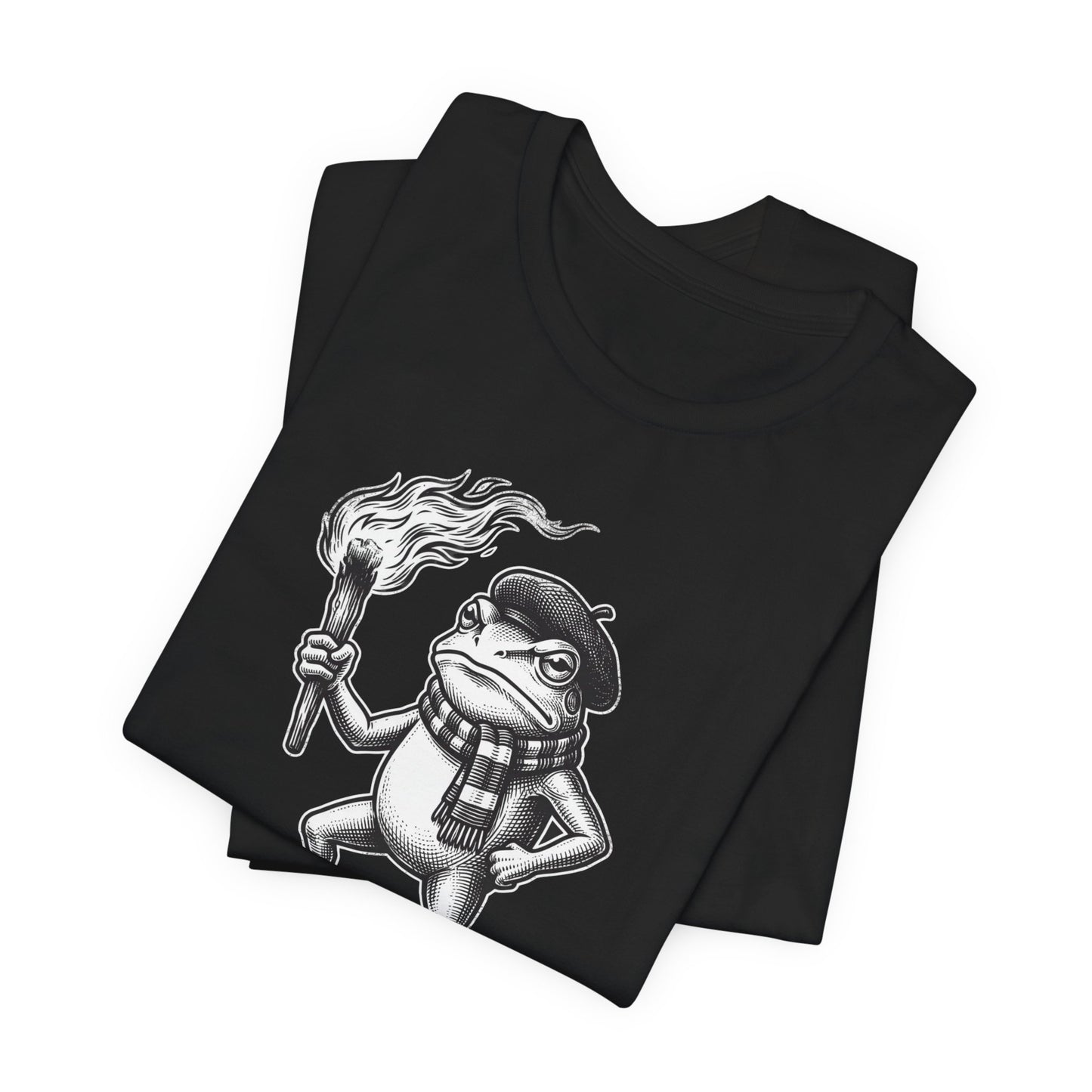 Black t-shirt featuring a cartoon frog wearing a beret and scarf holding a torch.