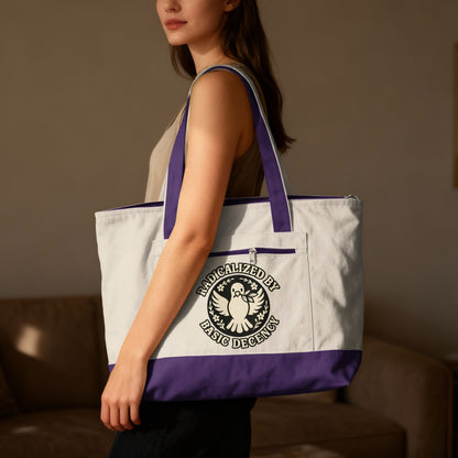 Canvas tote bag with purple trim featuring a peace dove and "Radicalized by Basic Decency" text.