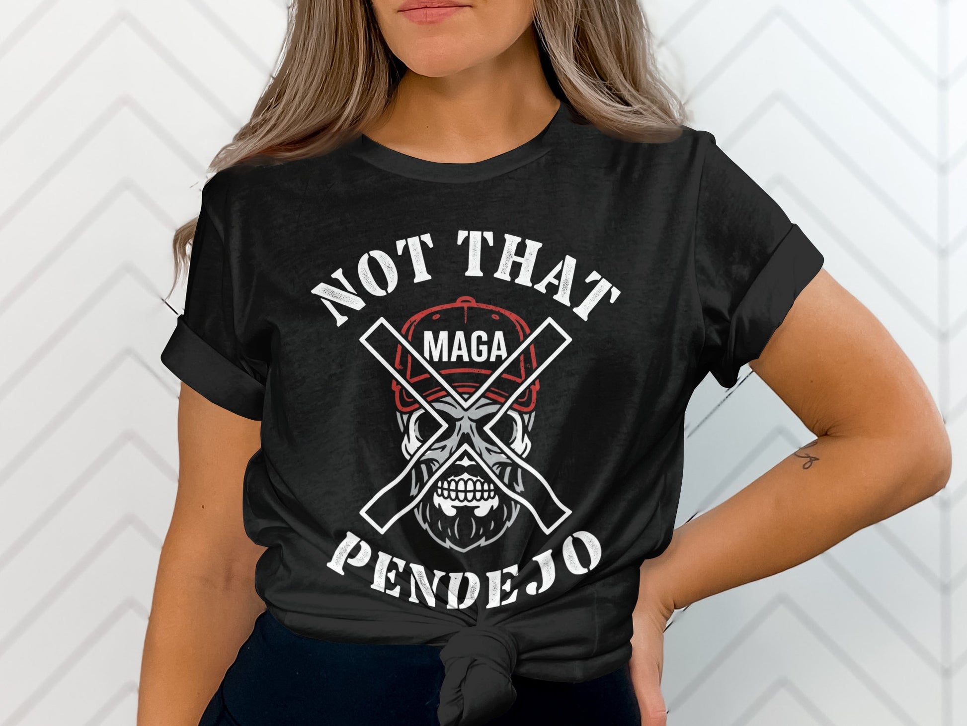 Black t-shirt with skull, MAGA hat, and text "NOT THAT PENDEJO".