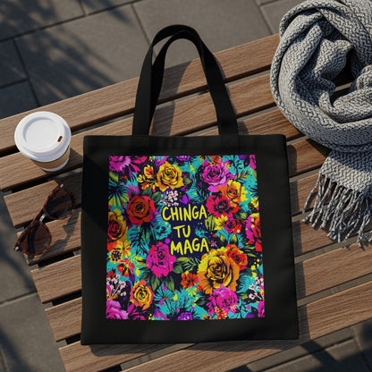 Black tote bag with vibrant floral print and "CHINGA TU MAGA" text.