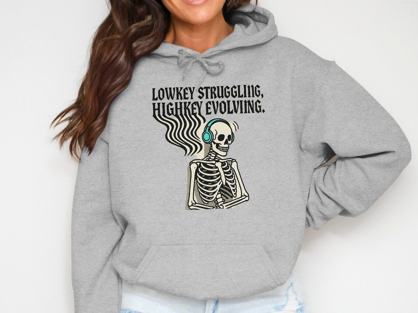 Lowkey Struggling Highkey Evolving Skeleton Hoodie Product