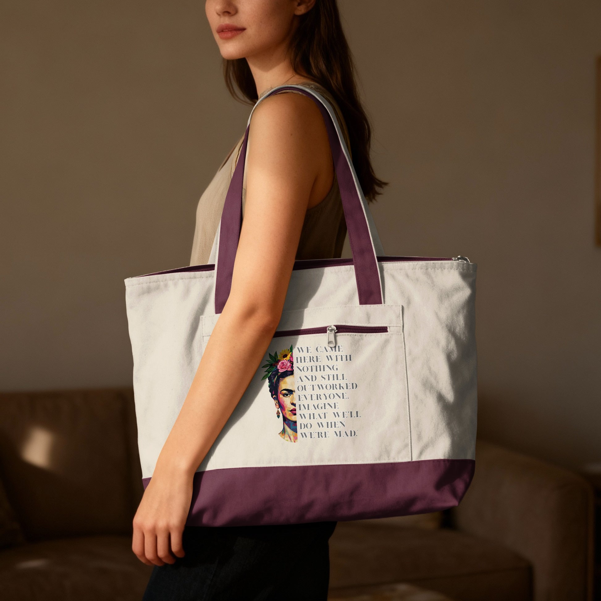 Tote bag with Frida Kahlo graphic and motivational quote.