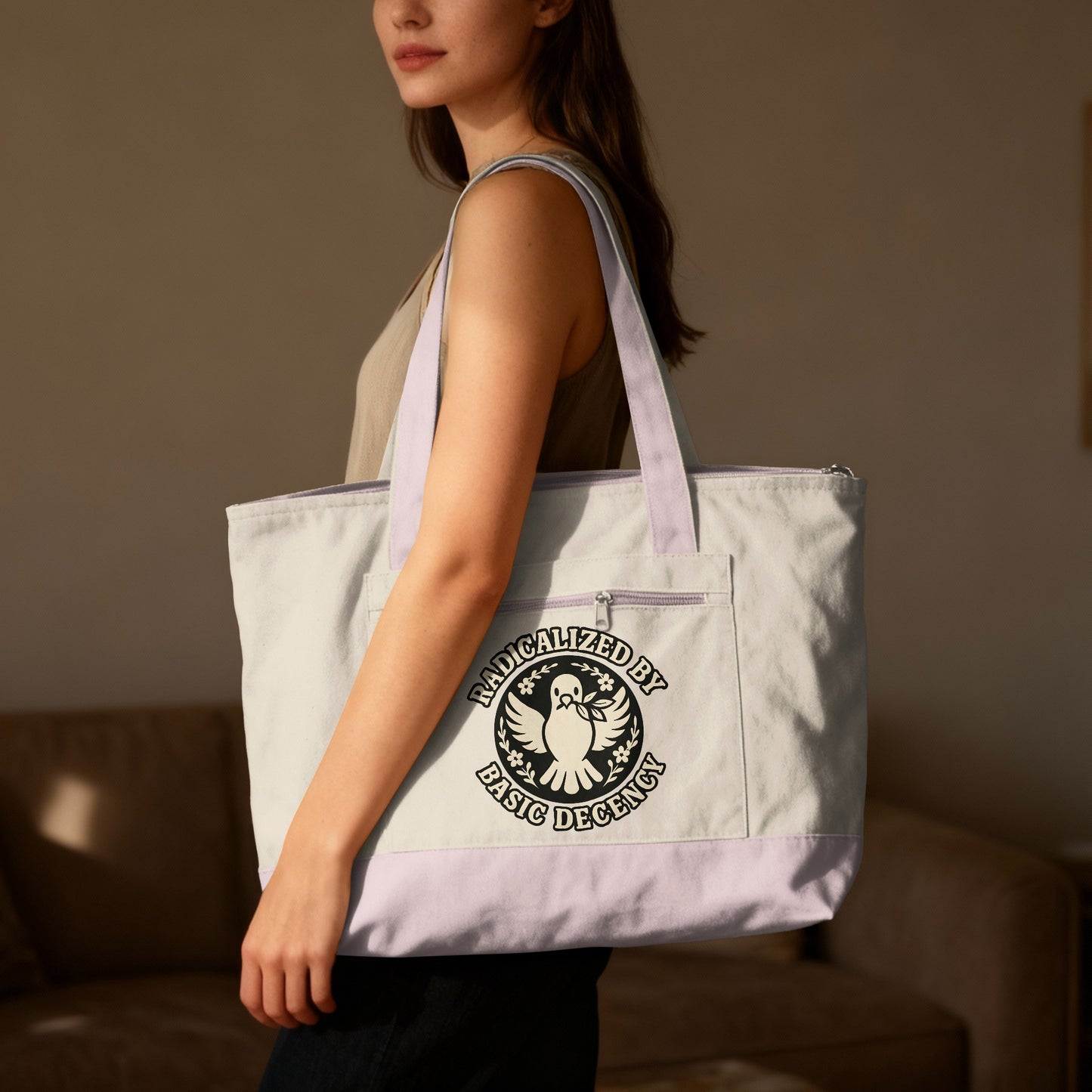 Tote bag with "Radicalized by Basic Decency" text and dove emblem.