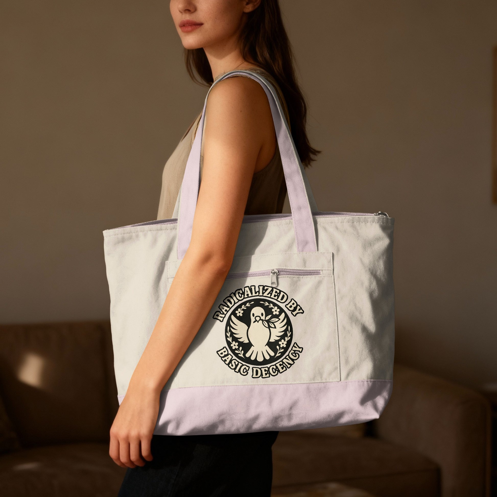 Tote bag with "Radicalized by Basic Decency" text and dove emblem.