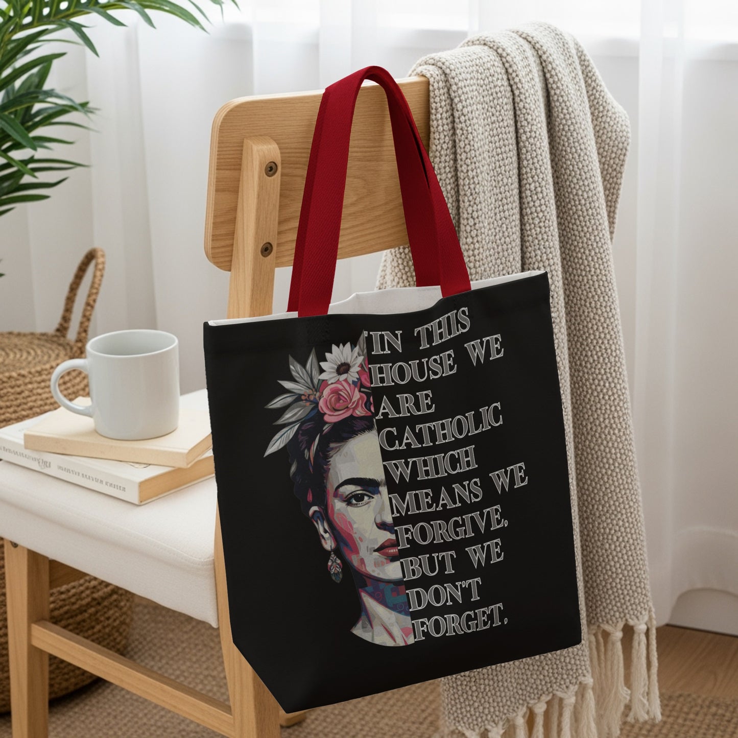 Tote bag with Frida Kahlo portrait and text about being Catholic.
