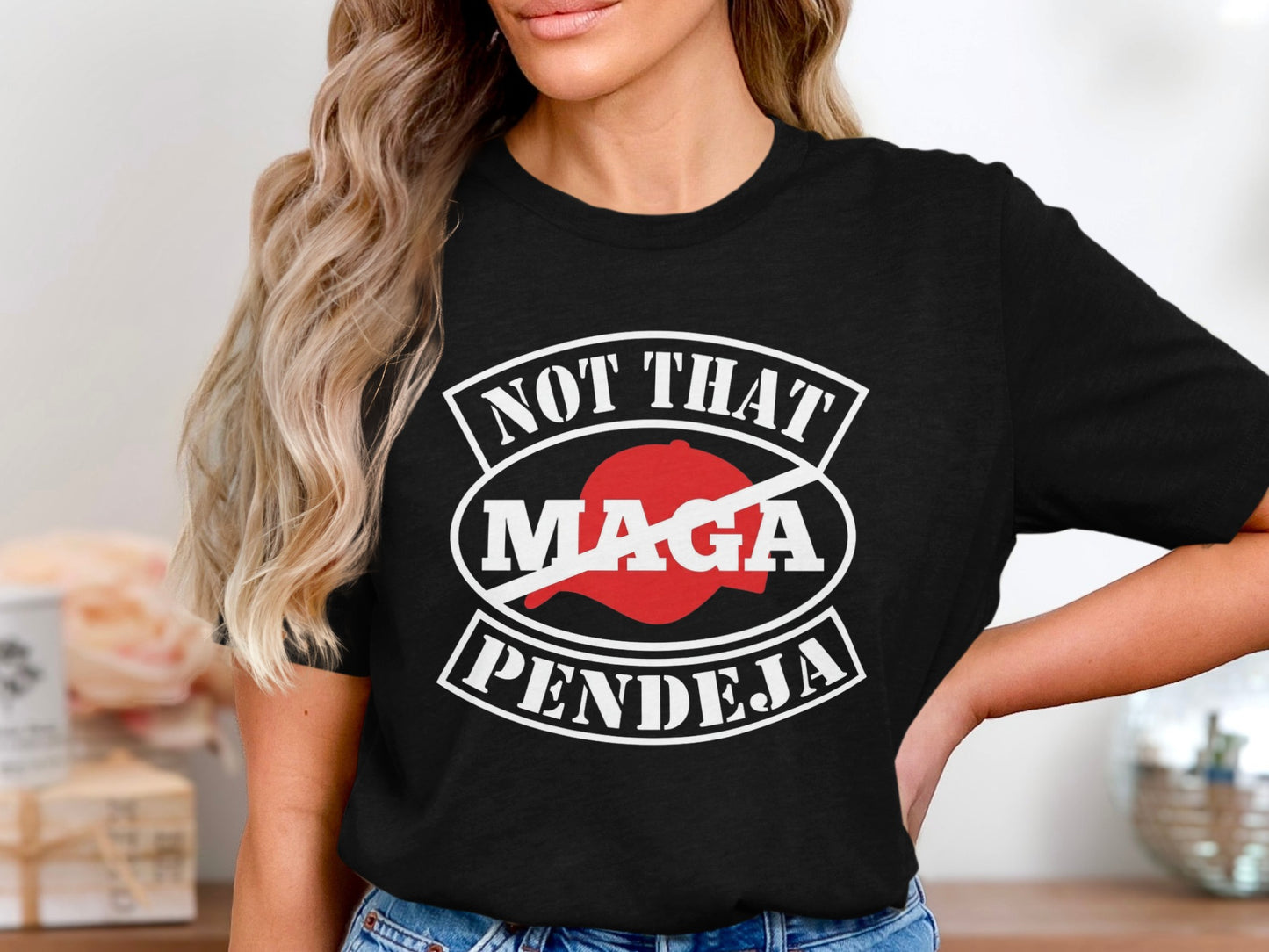 Black t-shirt with "NOT THAT MAGA PENDEJA" text and a crossed-out red "MAGA" logo.