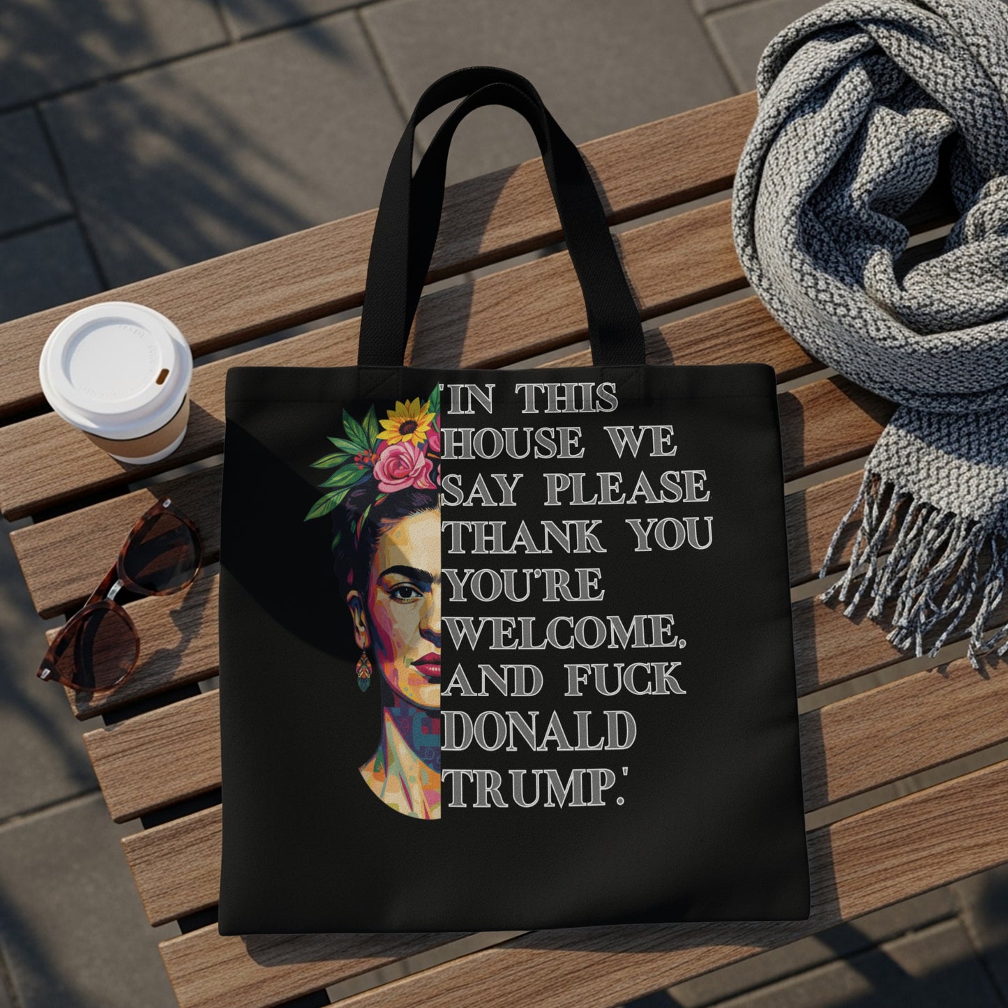 Tote bag with Frida Kahlo portrait and bold political text.