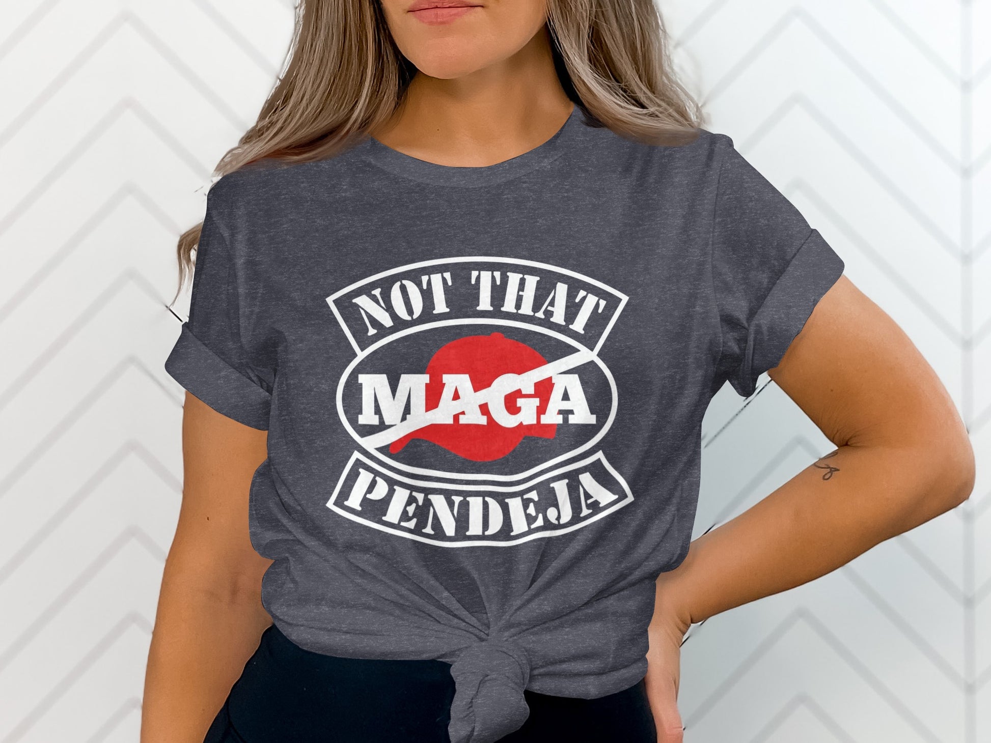 Dark grey t-shirt with "NOT THAT MAGA PENDEJA" and a red circle with a slash through "MAGA".