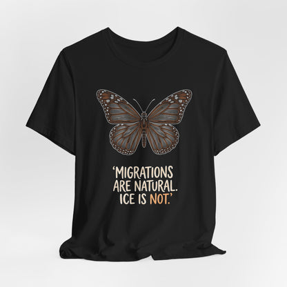 Black t-shirt with a brown monarch butterfly and the text "MigrATIONS ARE NATURAL. ICE IS NOT."
