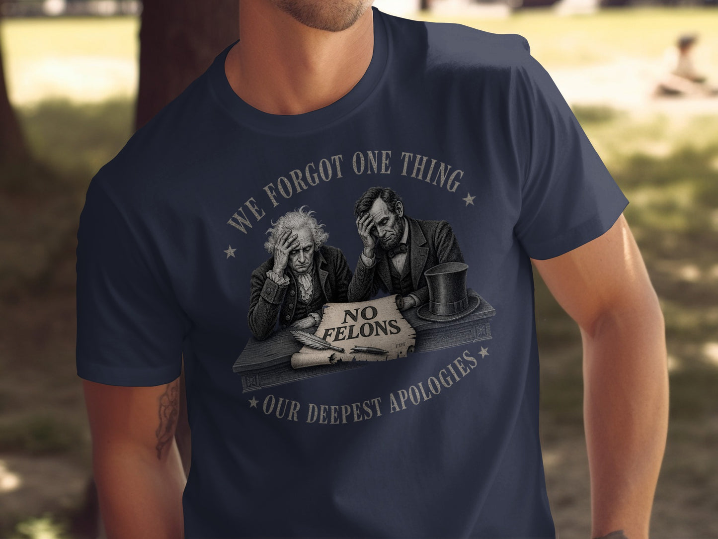 T-shirt graphic with "We Forgot One Thing. No Felons. Our Deepest Apologies." and historical figures.