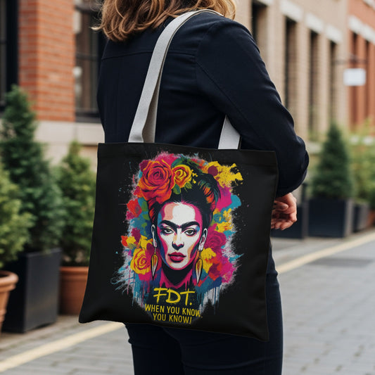 Black tote bag featuring a colorful Frida Kahlo portrait with "FDT. WHEN YOU KNOW YOU KNOW."