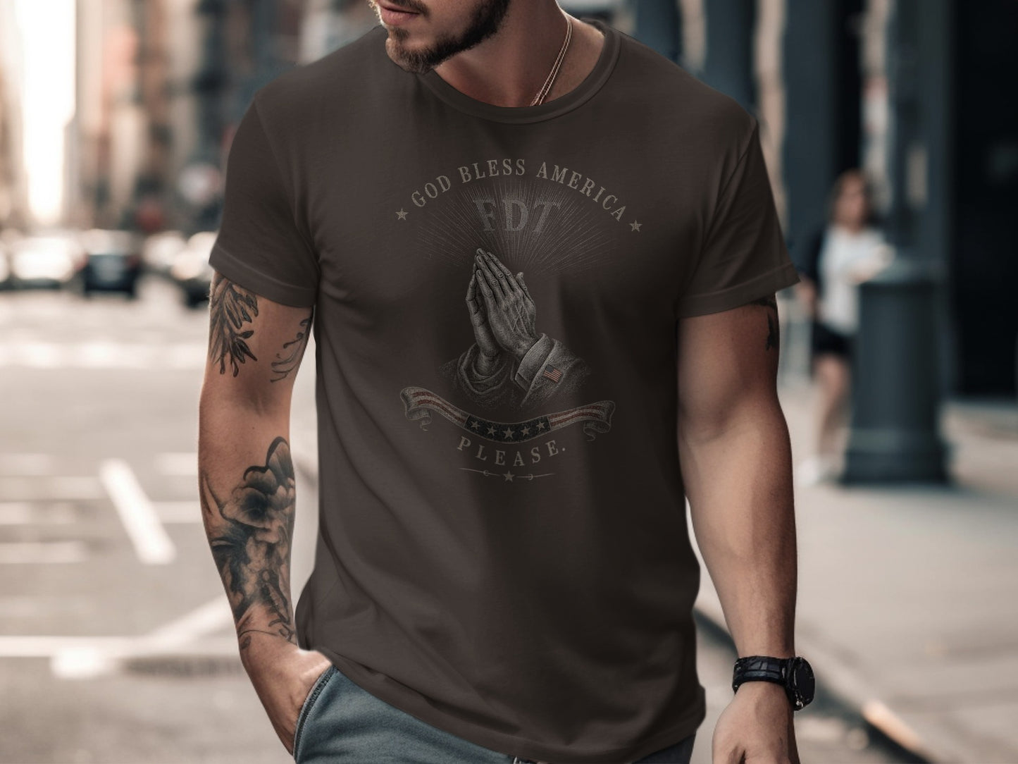 Brown t-shirt with praying hands and "GOD BLESS AMERICA" text.