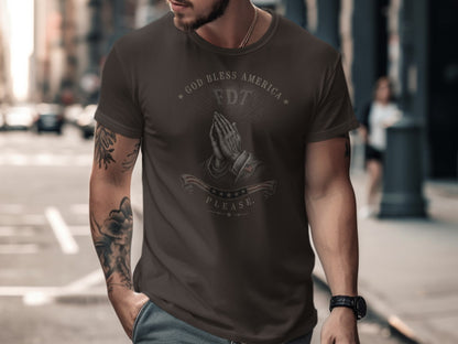 Brown t-shirt with praying hands and "GOD BLESS AMERICA" text.