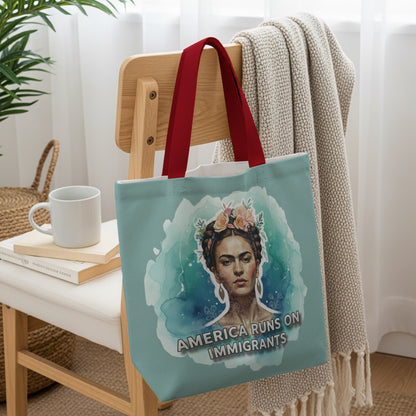 Tote bag featuring Frida Kahlo portrait with "America Runs on Immigrants" text.