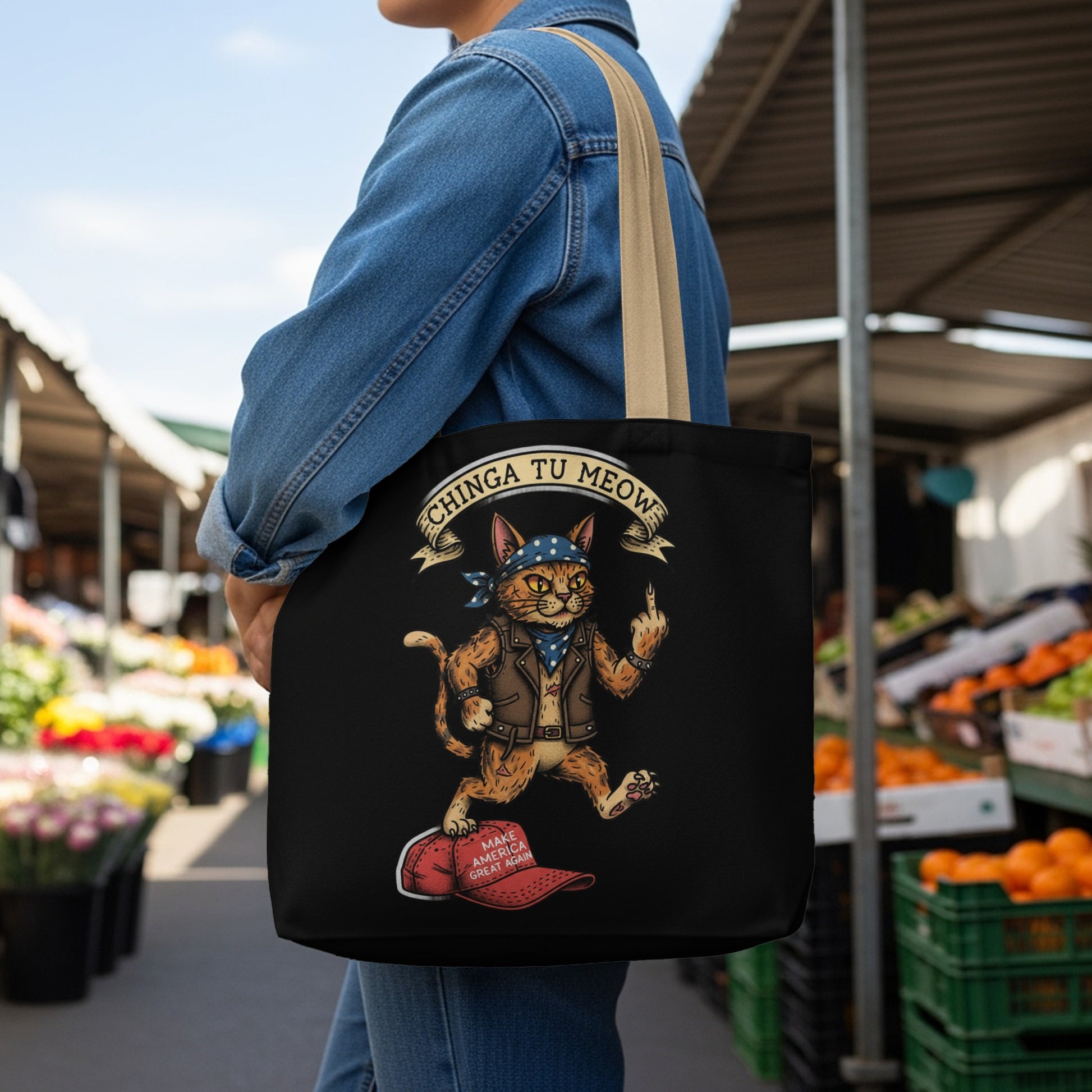 Black tote bag with a cat wearing a bandana and giving the middle finger.