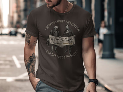 T-shirt with "WE'RE SO SORRY WE FORGOT TO SAY: NO FELONS." slogan.