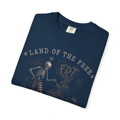 Skeleton grilling with "Land of the Free" text and US flag accents.