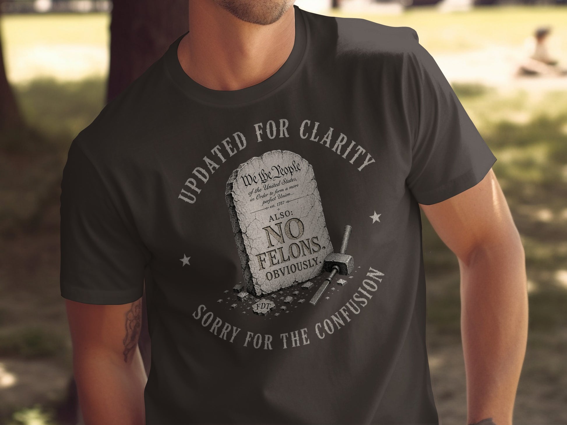 Dark t-shirt with "NO FELONS OBVIOUSLY" text from the Preamble.