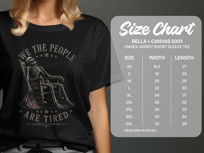 T-shirt size chart with skeleton graphic and "WE THE PEOPLE ARE TIRED" text.