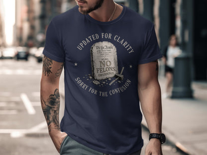 Navy t-shirt with "Updated for Clarity" text and "No Felons" slogan.