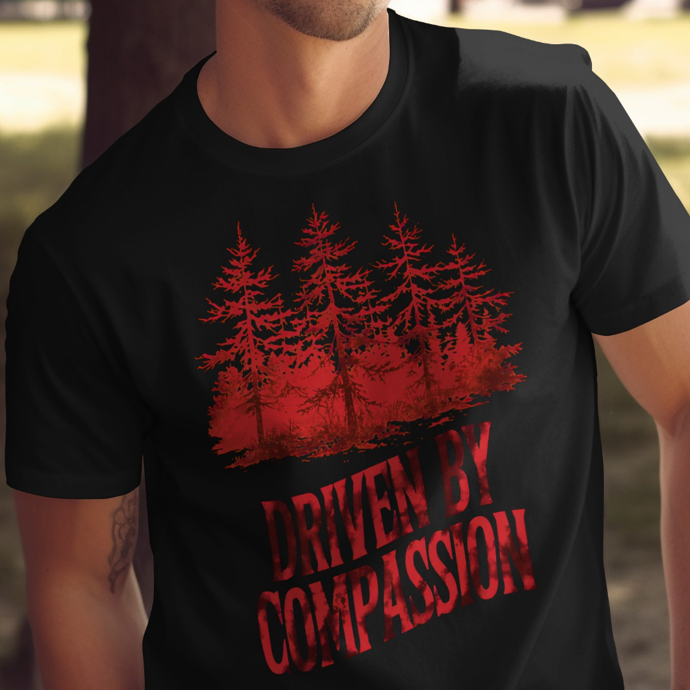Black t-shirt with red forest silhouette and "Driven by Compassion" text.