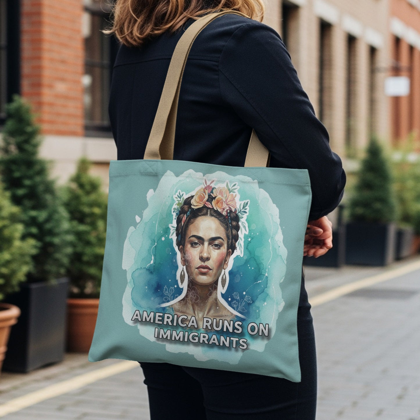 Frida Kahlo portrait with "America Runs on Immigrants" text on tote bag.
