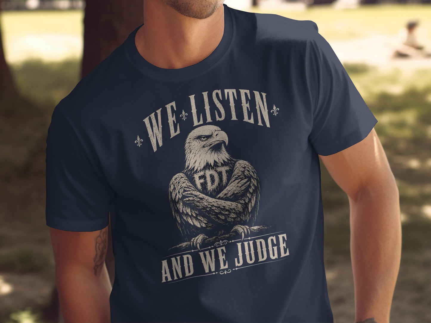 Navy t-shirt with an eagle graphic and "WE LISTEN AND WE JUDGE" text.